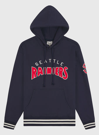 Seattle Rainiers 1941 Heavyweight Cotton Terry Pullover Hoodie by Ebbets Field. This navy blue pullover features “Seattle Rainiers” in bold white and red lettering across the front and a red S on the left sleeve. Detailed with classic white and navy striped cuffs and waistband for an authentic vintage baseball hoodie look.