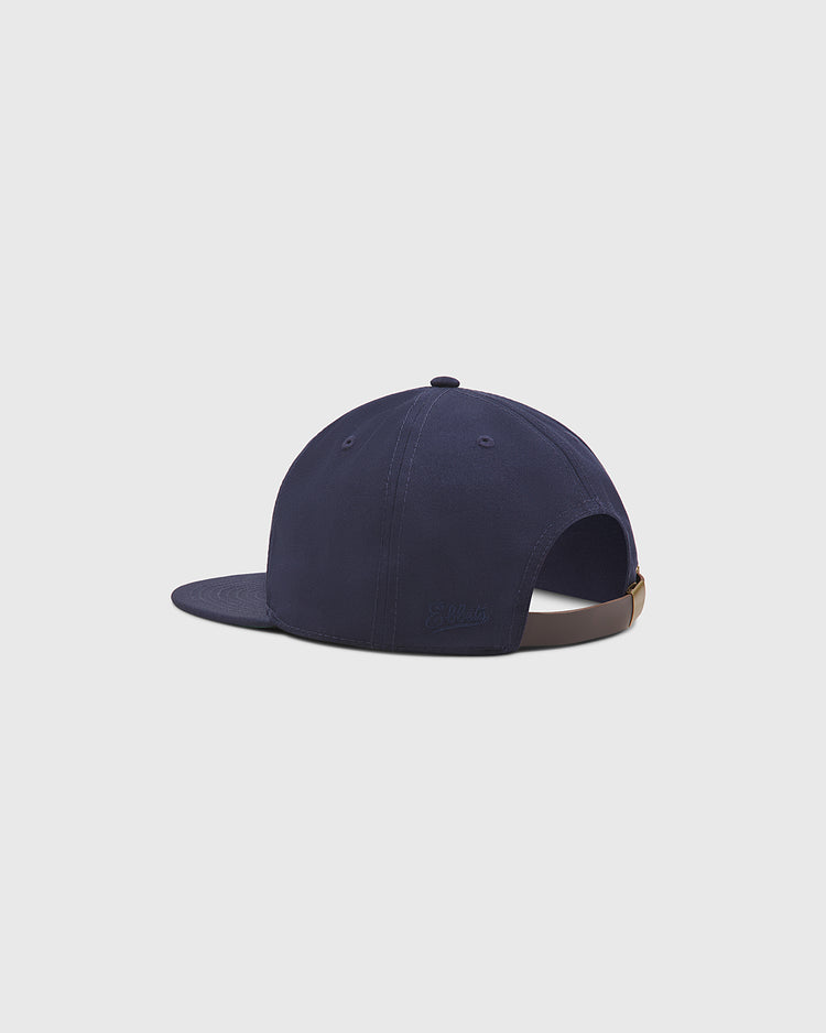 An angled back view of the Ebbets Field Philadelphia Stars Cotton Twill Ballcap, featuring a navy blue cotton twill fabric, brown adjustable strap with a buckle, and set against a plain light gray background for a classic and versatile look inspired by Negro League hat traditions.
