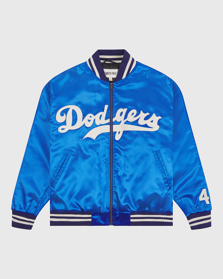 The EFF Brooklyn Dodgers 1947-50 Authentic All Satin Varsity Jacket features a bright blue satin finish, classic white Dodgers script across the chest, striped collar, cuffs, and hem, and the number 44 on the left sleeve. Inspired by the iconic team jacket from 1947 honoring Jackie Robinson’s legacy, this piece is displayed laid flat on a light background.