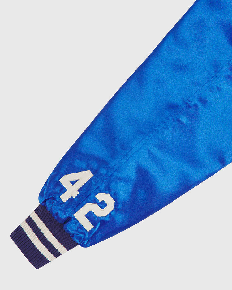 A close-up of the sleeve on the EFF Brooklyn Dodgers 1947-50 Authentic All Satin Varsity Jacket in royal blue, featuring a white number 42 near the striped blue and white cuff.