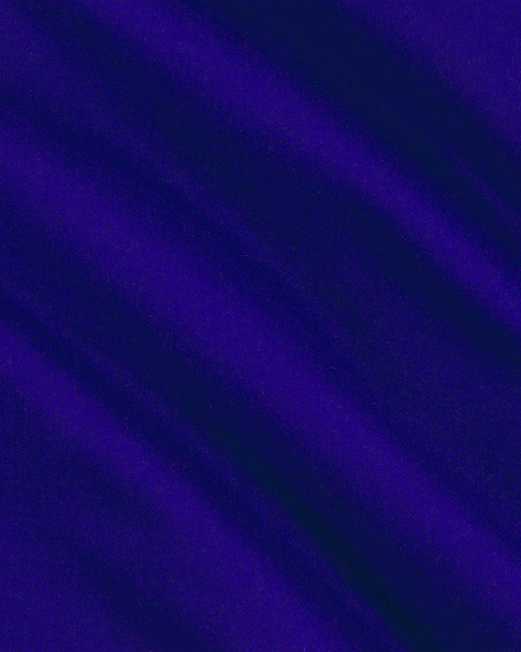 Rich deep purple wool forms the base of the Chicago Cubs 1954 Authentic All Wool Varsity Jacket by EFF, with soft, wavy folds that create a smooth and flowing vintage texture reminiscent of classic varsity styles. Carefully placed lighting brings out the richness and depth of the color, accentuating the gentle undulations across the woolen surface.
