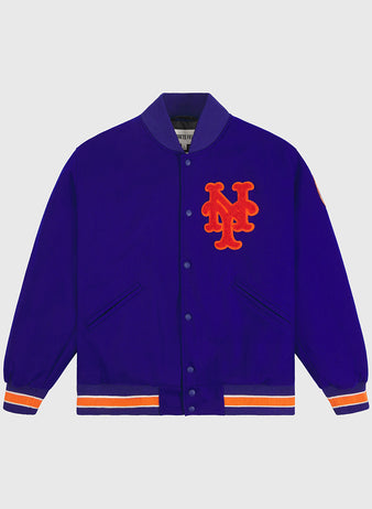 The EFF New York Mets 1969 Authentic All Wool Varsity Jacket boasts a royal blue body with orange and white striped cuffs and hem, highlighted by an orange interlocking NY logo on the chest—an authentic reproduction that captures the spirit of the Miracle Mets and pays tribute to the iconic jacket worn by the legendary 1969 team.