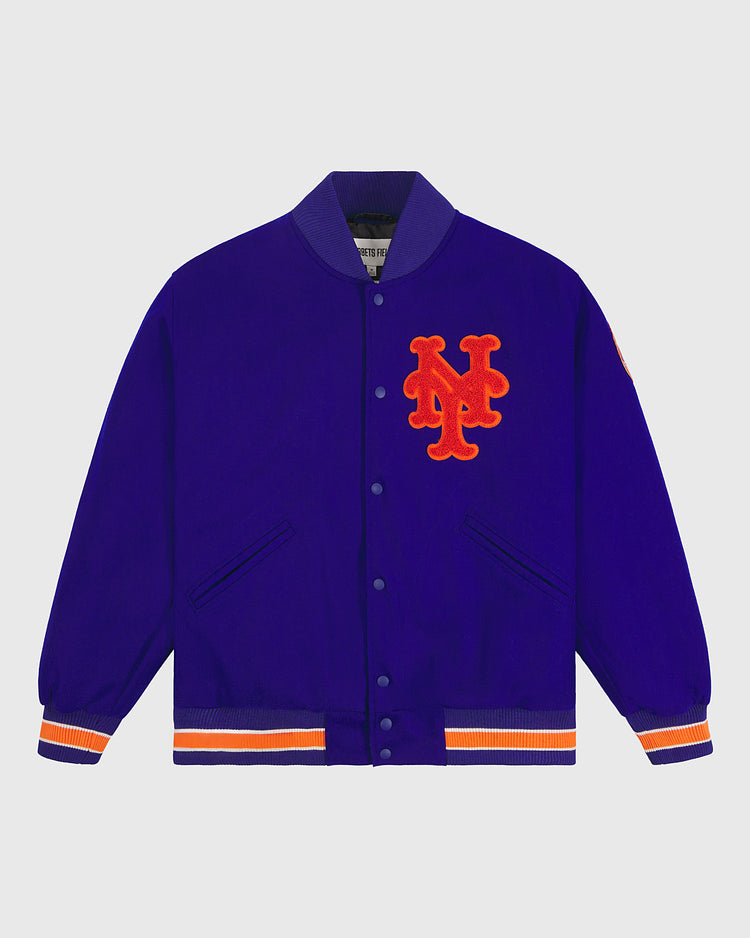The EFF New York Mets 1969 Authentic All Wool Varsity Jacket boasts a royal blue body with orange and white striped cuffs and hem, highlighted by an orange interlocking NY logo on the chest—an authentic reproduction that captures the spirit of the Miracle Mets and pays tribute to the iconic jacket worn by the legendary 1969 team.