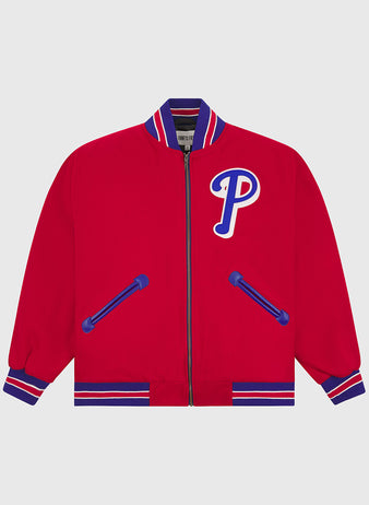 The EFF Philadelphia Phillies 1949 Authentic All Wool Varsity Jacket features a bold red body with blue and white striped cuffs, collar, and hem, blue-trimmed pockets, and a large blue-and-white “P” patch on the left chest—faithfully inspired by classic vintage team styles.