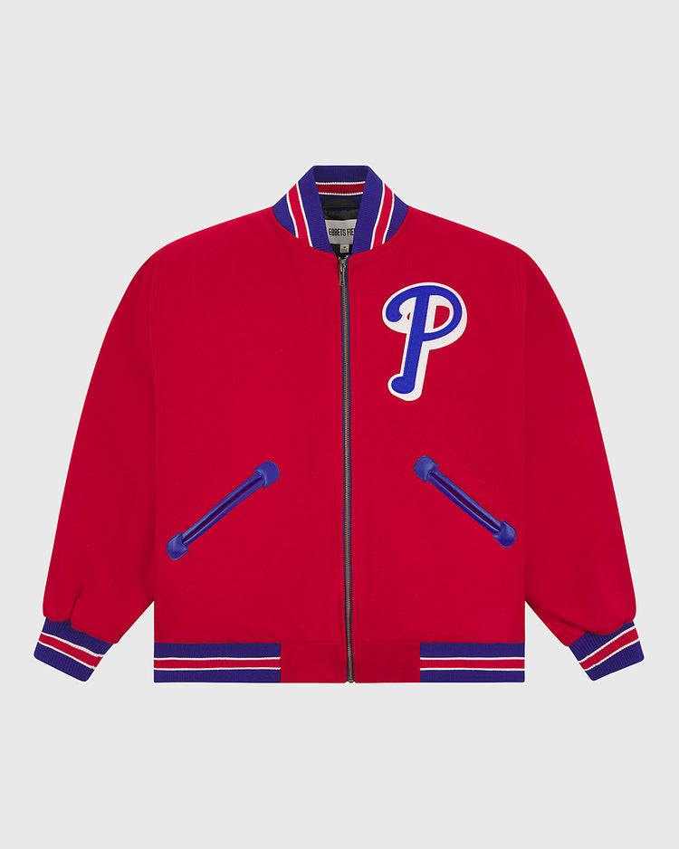 The EFF Philadelphia Phillies 1949 Authentic All Wool Varsity Jacket features a bold red body with blue and white striped cuffs, collar, and hem, blue-trimmed pockets, and a large blue-and-white “P” patch on the left chest—faithfully inspired by classic vintage team styles.
