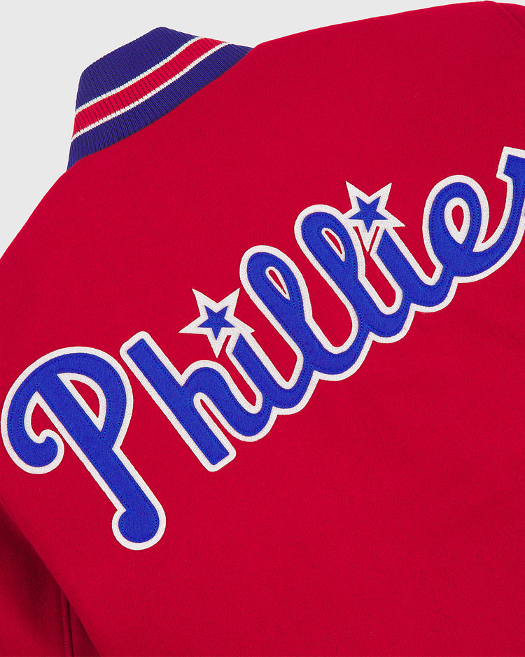 EFF Philadelphia Phillies 1949 Authentic All Wool Varsity Jacket, featuring a red design with blue and white trim, “Phillies” in blue and white script dotted with stars on the i’s across the back—faithfully reproducing the classic style of the 1949 Phillies team jacket.