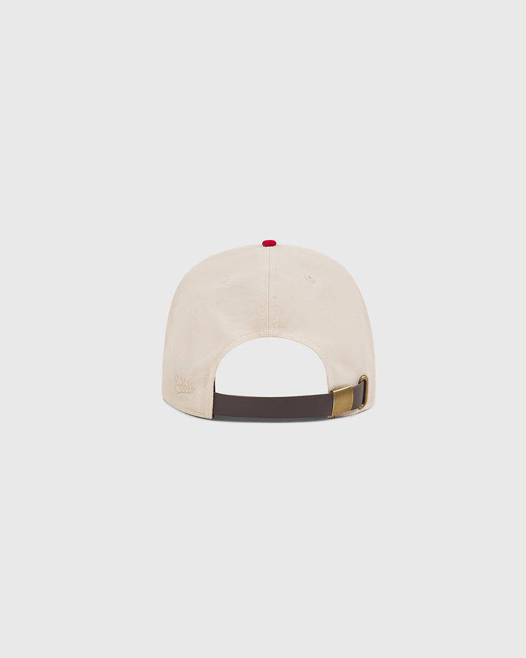 An Ebbets Field Hilldale Athletic Club 1924 Cotton Twill Ballcap in beige, shown from the back with an adjustable dark strap and metal buckle, topped with a small red button—evoking the style of the original 1924 ballcaps.