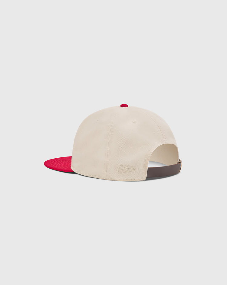 The Hilldale Athletic Club 1924 Cotton Twill Ballcap by Ebbets Field features a cream-colored cotton twill body with a red brim and button, shown from the back. The cap includes a brown adjustable strap and subtle embroidery above the strap, evoking the classic style of Negro League hats.