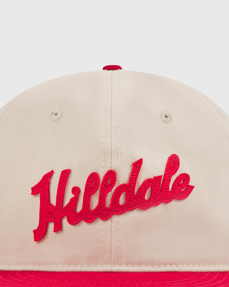 Introducing the Ebbets Field Hilldale Athletic Club 1924 Cotton Twill Ballcap—a beige cotton twill cap featuring striking red stitching and a bold red brim. 