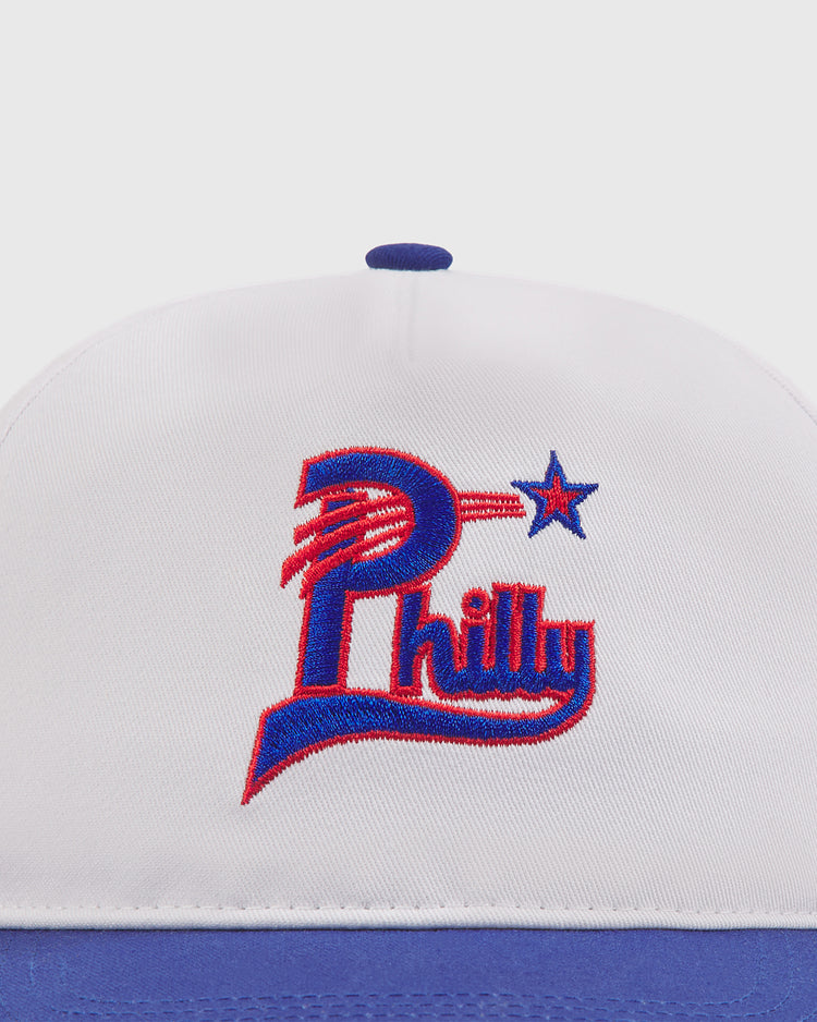 Sure! Here’s a revised sentence using your provided product data: The Ebbets Field Philadelphia Stars A-Frame Cotton Twill Ballcap is a white and blue retro baseball hat with 