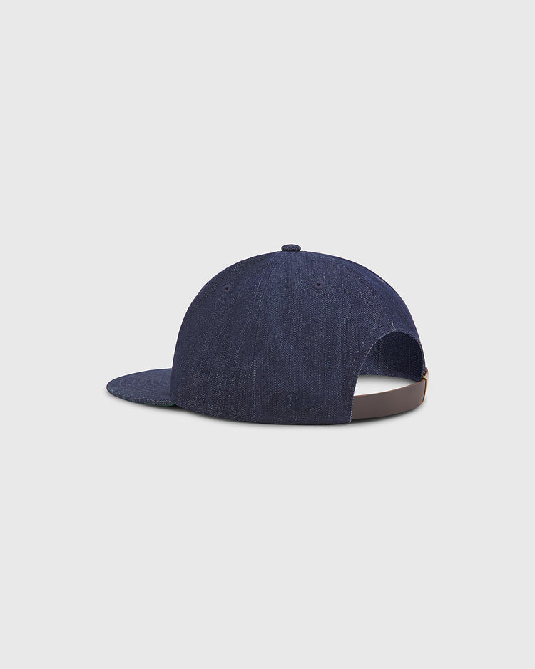 The Ebbets Field New York Black Yankees Indigo Cotton Denim Ballcap is displayed from the back, showcasing its brown adjustable strap and top button, set against a plain light gray background.