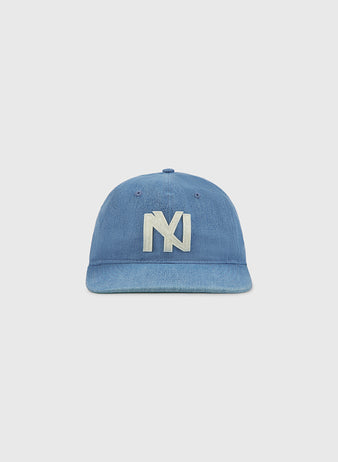An indigo cotton denim ballcap by Ebbets Field, featuring a large white embroidered overlapping 'N' and 'Y' logo on the front in the classic style of the New York Brooklyn Eagles, displayed against a plain light background.