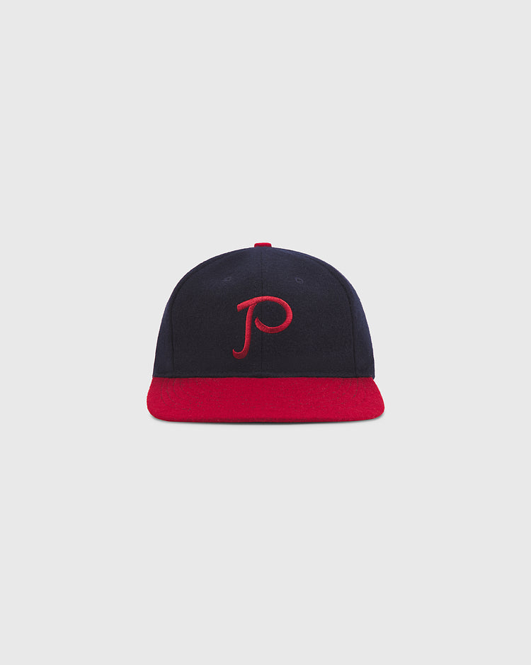 The Ebbets Field Philadelphia Stars 1940 Authentic Wool Ballcap features a navy blue crown, a red brim, and a red embroidered 'P' on the front, shown here against a plain light gray background.