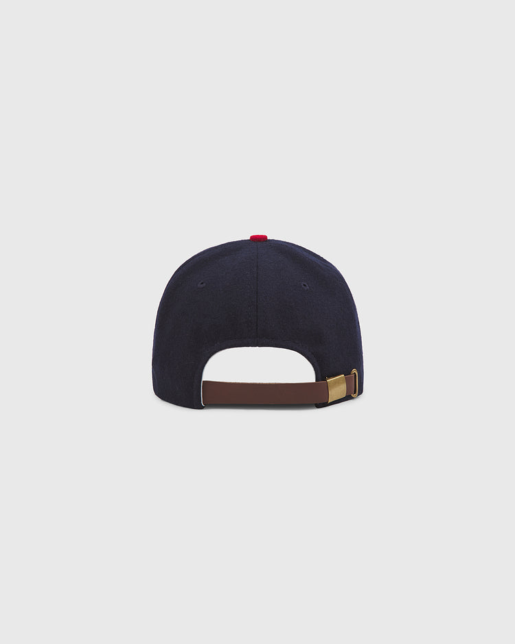 The Ebbets Field Philadelphia Stars 1940 Authentic Wool Ballcap is displayed from the back, highlighting its brown adjustable strap with a gold buckle. The classic navy blue cap rests against a simple, light gray background.