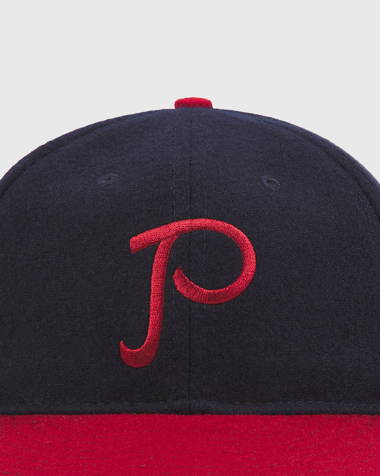 The Ebbets Field Philadelphia Stars 1940 Authentic Wool Ballcap is a navy blue and red cap featuring a red embroidered 