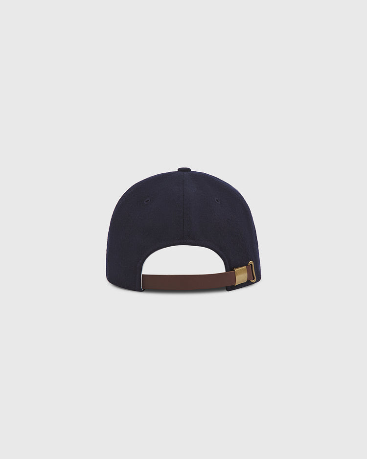 A rear view of the Ebbets Field Philadelphia Stars 1934 Authentic Wool Ballcap in navy blue wool, featuring a brown adjustable strap with a metal buckle. Set against a plain light gray background, this cap evokes the classic style of the original 1934 Negro League design.