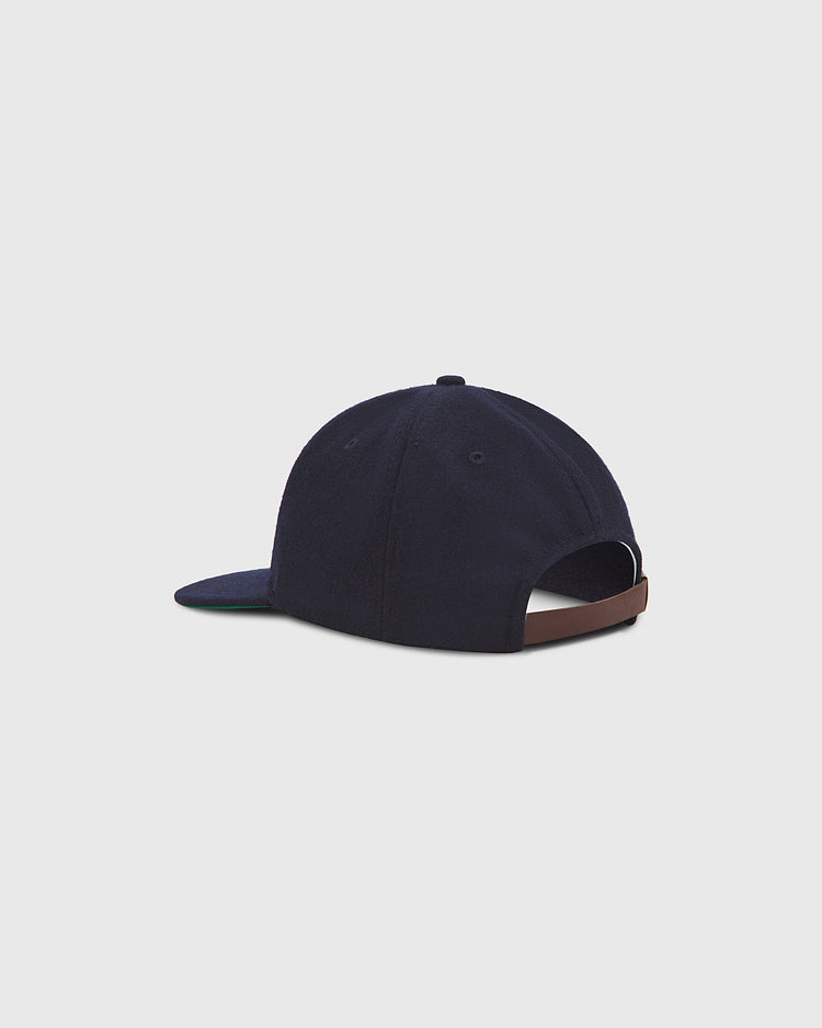 An Ebbets Field Philadelphia Stars 1934 Authentic Wool Ballcap, crafted from navy blue wool and inspired by the historic team, is displayed from the back. The cap showcases a brown adjustable strap and a curved brim, set against a plain light gray background.