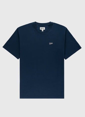 The Ebbets Field Flannels Ebbets Chest Logo Short Sleeve Tee is a durable navy cotton shirt featuring a small white embroidered logo on the left chest, shown against a light gray background.