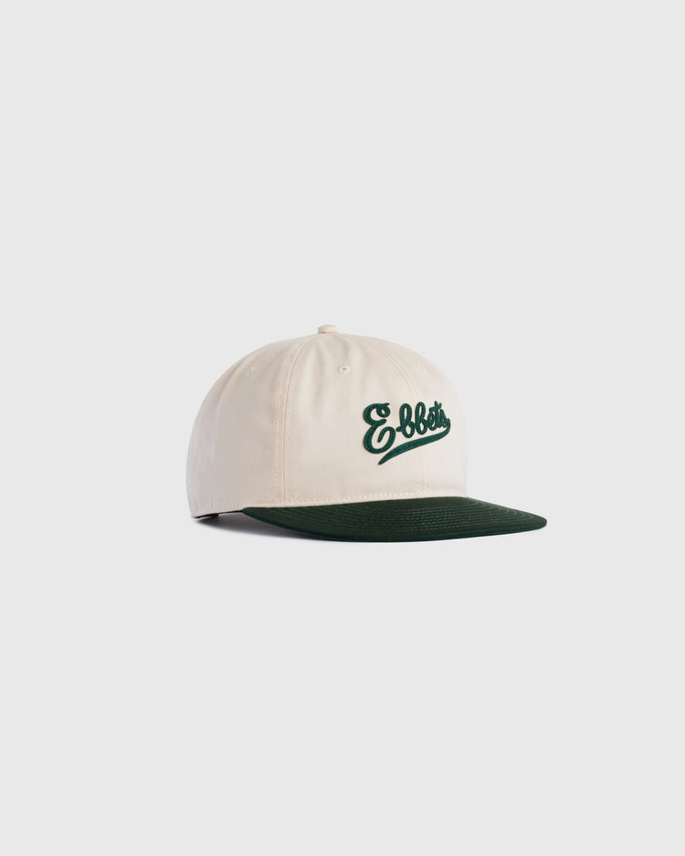 The Ebbets Field Flannels Felt Script Cotton Twill Ballcap features a cream cotton twill crown, dark green brim, and green embroidered Ebbets script—perfect for daily wear and shown here on a plain white background.