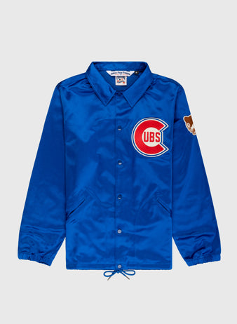 The EFF Chicago Cubs 1946 Satin Windbreaker Jacket features blue satin, a large Cubs logo on the left chest, bear patch on the sleeve, collar, elastic cuffs, front pockets, and a drawstring hem.