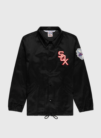 The EFF Chicago White Sox 1959 Satin Windbreaker Jacket features a black button-up design, red and white SOX chest logo, colorful embroidered sleeve patch, collar, front pockets, drawstring hem, and satin finish—a standout vintage MLB style.
