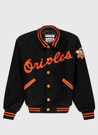 The EFF Baltimore Orioles 1966 Authentic All Wool Varsity Jacket features black wool, orange Orioles script, orange buttons, striped cuffs and collar, plus a sleeve bird logo patch—an authentic World Series replica.