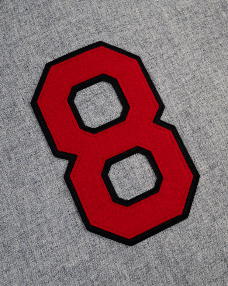 A large red number 8 with a black outline is stitched onto light gray wool, echoing the Birmingham Black Barons 1948 Authentic Road Baseball Jersey by Ebbets Field, as seen at the Negro Leagues Baseball Museum.