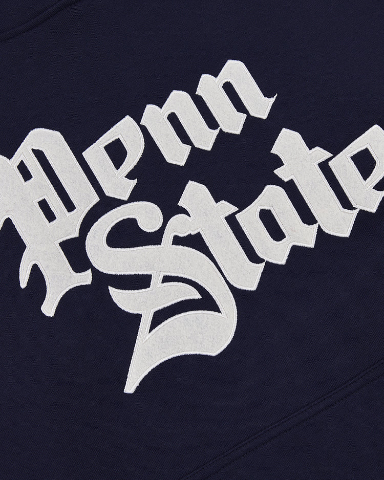 Close-up of white, Gothic-style Penn State lettering on the navy PENN STATE HOODIE by Ebbets Field.