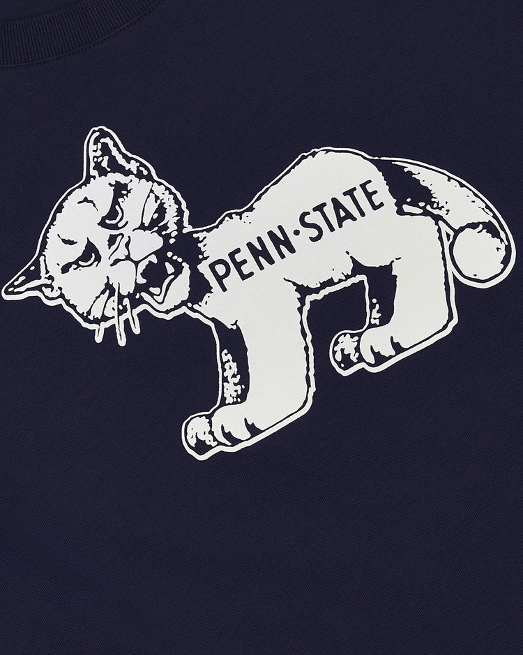 The Ebbets Field PENN STATE SS TEE NAVY features a vintage-style white cartoon cat with a frowning face and PENN STATE across its body, printed on a dark blue tee.