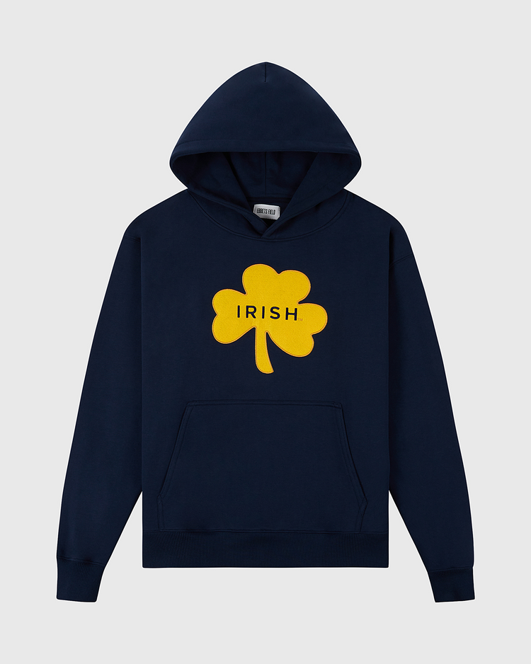 The Ebbets Field University of Notre Dame Heavyweight Cotton Terry Pullover Hoodie features a navy vintage look, bold yellow shamrock with black IRISH text, front pocket, and drawstring hood for comfort and style.