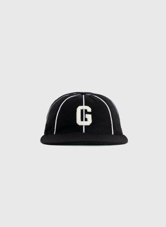 The EFF Homestead Grays 1939 Authentic Wool 8-Panel Ballcap features a black design with thin white stripes and a large white “G” on the front, displayed against a plain gray background.