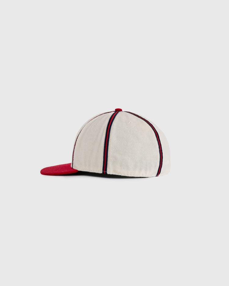 The EFF Kansas City Monarchs 1942 Authentic Wool Ballcap features a white crown with dark vertical stripes and a red brim, displayed from the side against a plain light background.