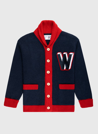 The Ebbets Field Flannels Washington Senators 1963-67 Wool Shawl Collar Sweater features navy wool, red trim and buttons, red pocket and cuff details, plus a large white, red, and black “W” patch—vintage on-field baseball style.