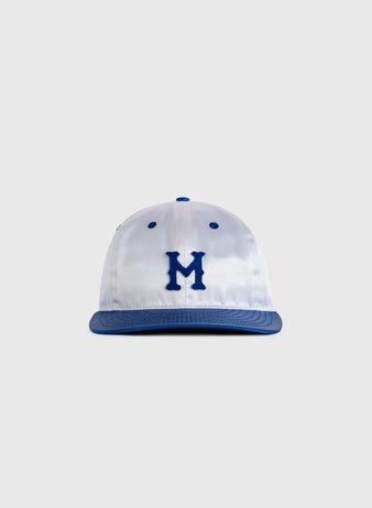 The EFF Montreal Royals 1946 Authentic All Satin Ballcap features a white crown, blue brim, and bold blue M on the front, shown against a plain light gray background.