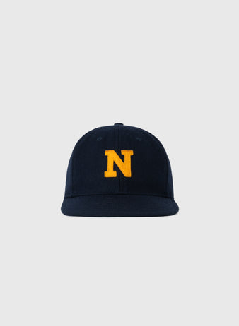 The EFF Navy 1928 Authentic Wool Ballcap features a yellow N embroidered on navy blue wool, inspired by the 1928 design, and is shown against a plain light gray background.