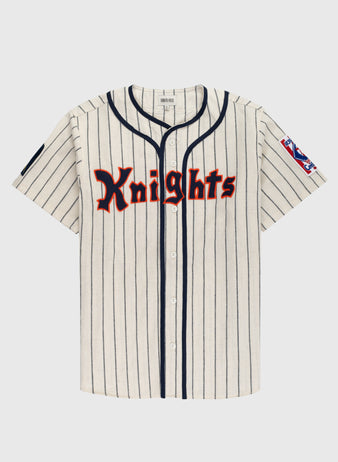The Ebbets Field New York Knights 1939 Authentic Wool Home Baseball Jersey from The Natural features cream wool with black pinstripes, navy trim, a stars-and-stripes patch, and Knights in red and black across the chest.