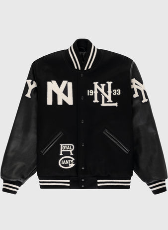 The Ebbets Field Negro League Wool & Leather Varsity Jacket features black wool, black leather sleeves with white letter patches, striped cuffs and collar, plus bold “NY” and “NL 1933” patches on the front.