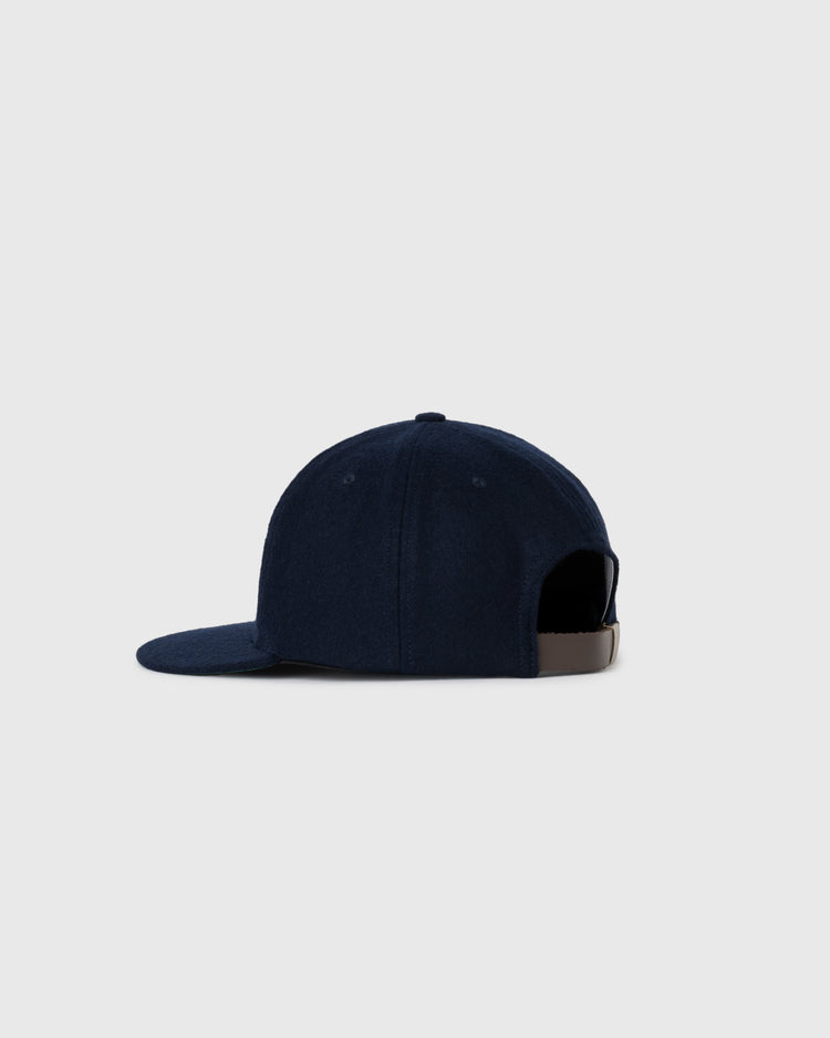 The EFF New York Black Yankees 1936 Authentic Wool Ballcap, in dark blue with a flat brim and adjustable strap, channels classic Negro Leagues style, shown in side profile on a light gray background.