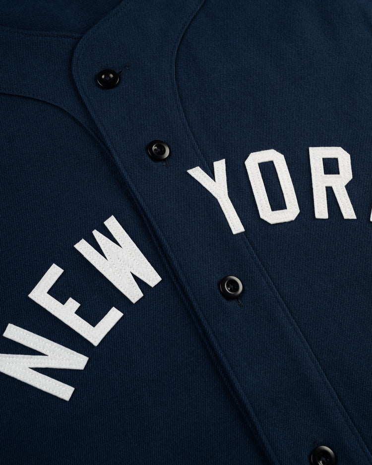 Close-up of the Ebbets Field New York Black Yankees Cotton Twill Baseball Jersey, featuring bold white NEW YORK lettering inspired by classic Negro Leagues Black Yankees designs.