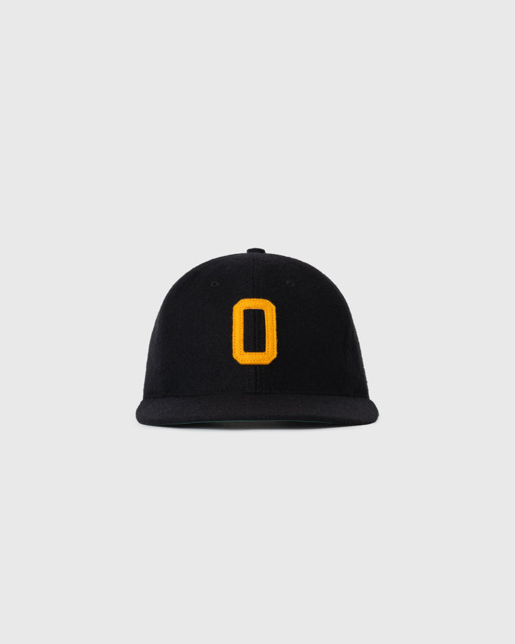 The EFF Oakland Larks 1946 Authentic Wool Ballcap is a black cap with a flat brim and bold yellow O on the front, shown against a light gray background.