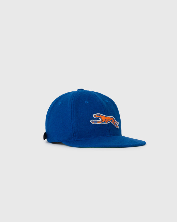 The Ebbets Field NEW - Pacific Greyhound 1939 Vintage Ballcap, featuring a small embroidered orange and white tiger patch on the front, is shown against a plain light gray background.