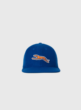 The EFF Pacific Greyhounds 1939 Authentic Wool Softbrim Ballcap, in blue, features an embroidered orange and black leaping tiger logo inspired by the original 1939 design, shown on a plain light gray background.