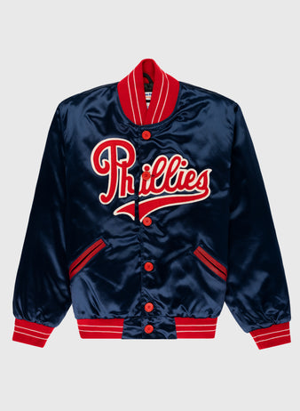The EFF Philadelphia Phillies 1937 Authentic All Satin Varsity Jacket features navy blue satin with red and white striped cuffs, collar, and hem, and “Phillies” boldly embroidered across the chest, inspired by the Baker Bowl era.