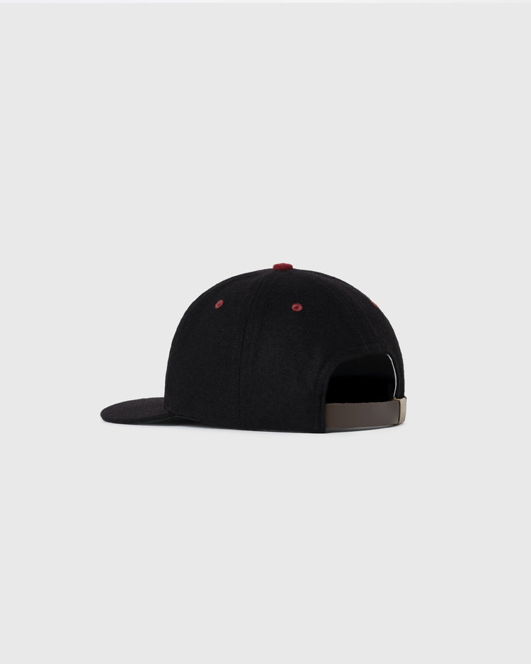 The EFF Harvard University Crimson H Authentic Wool Ballcap is shown from the back on a light gray background, with an adjustable strap and red eyelets—a classic Ivy League-inspired reproduction.