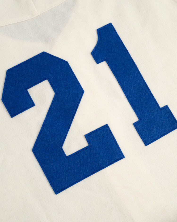 A bold blue number 21 is stitched on white wool, mirroring the iconic Santurce Cangrejeros home jersey—a faithful Ebbets Field reproduction of the 1954 Roberto Clemente Authentic Home Baseball Jersey.