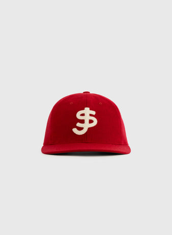 The Ebbets Field Flannels San Juan Senadores 1947 Authentic Wool Ballcap is a red replica hat with a bold white dollar sign on the front, inspired by the Puerto Rican League team and shown against a plain light gray background.