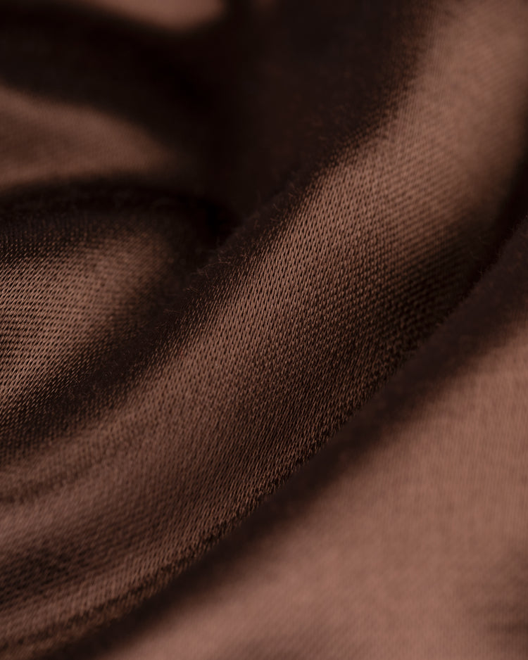 Close-up of smooth brown satin with soft folds and shine, showcasing the elegant drape of the EFF San Diego Padres 1969 Authentic All Satin Varsity Jacket—ideal for a true vintage look.