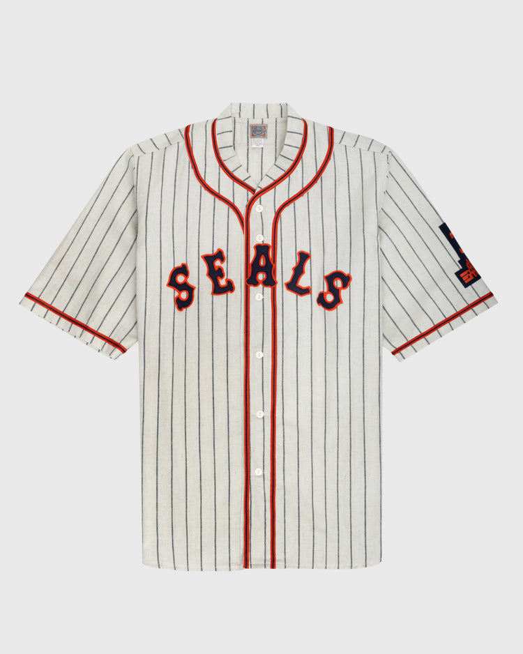The Ebbets Field San Francisco Seals 1938 Authentic Wool Home Baseball Jersey features a vintage white design with black pinstripes, red trim, and bold red SEALS lettering, faithfully reproducing the classic 1938 original.
