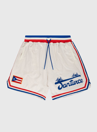 The Ebbets Field Santurce Cangrejeros Mesh Shorts feature white mesh fabric, red and blue trim, a blue drawstring, and the Puerto Rican flag on the left leg, inspired by baseball legend Roberto Clemente.