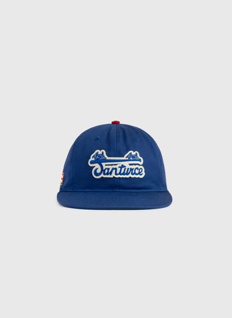 The Ebbets Field Santurce Cangrejeros Cotton Twill Ballcap features “Santurce” in white script, two blue crab illustrations above the text, a red top button, and a light gray background—ideal for Puerto Rican baseball fans.